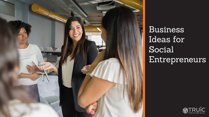 A group of entrepreneurs standing around talking.