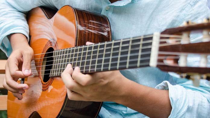 Person playing guitar.